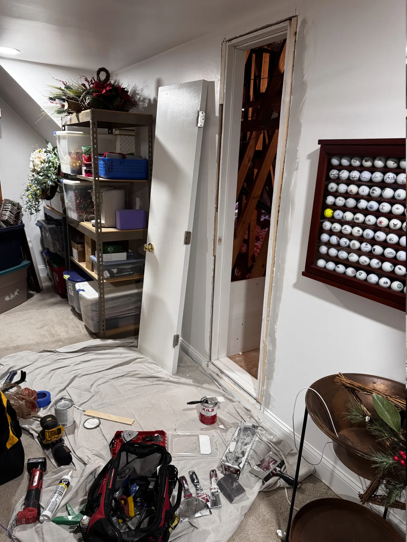 Attic access door trim repair and wall prep in progress