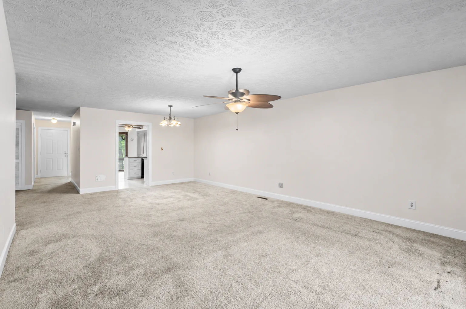 Finished interior paint across an open living room and entry