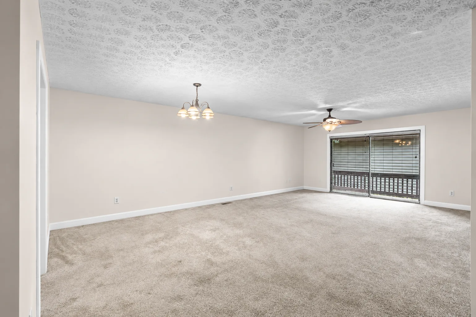 Finished living room walls and white trim beside a large window