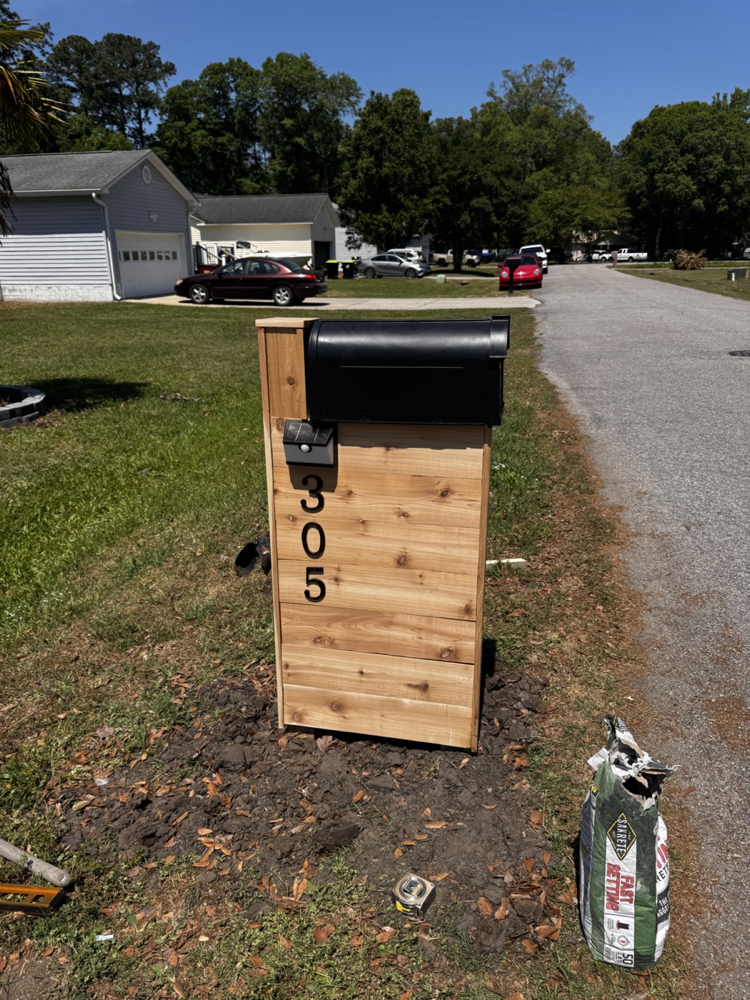 Custom wooden mailbox post installation