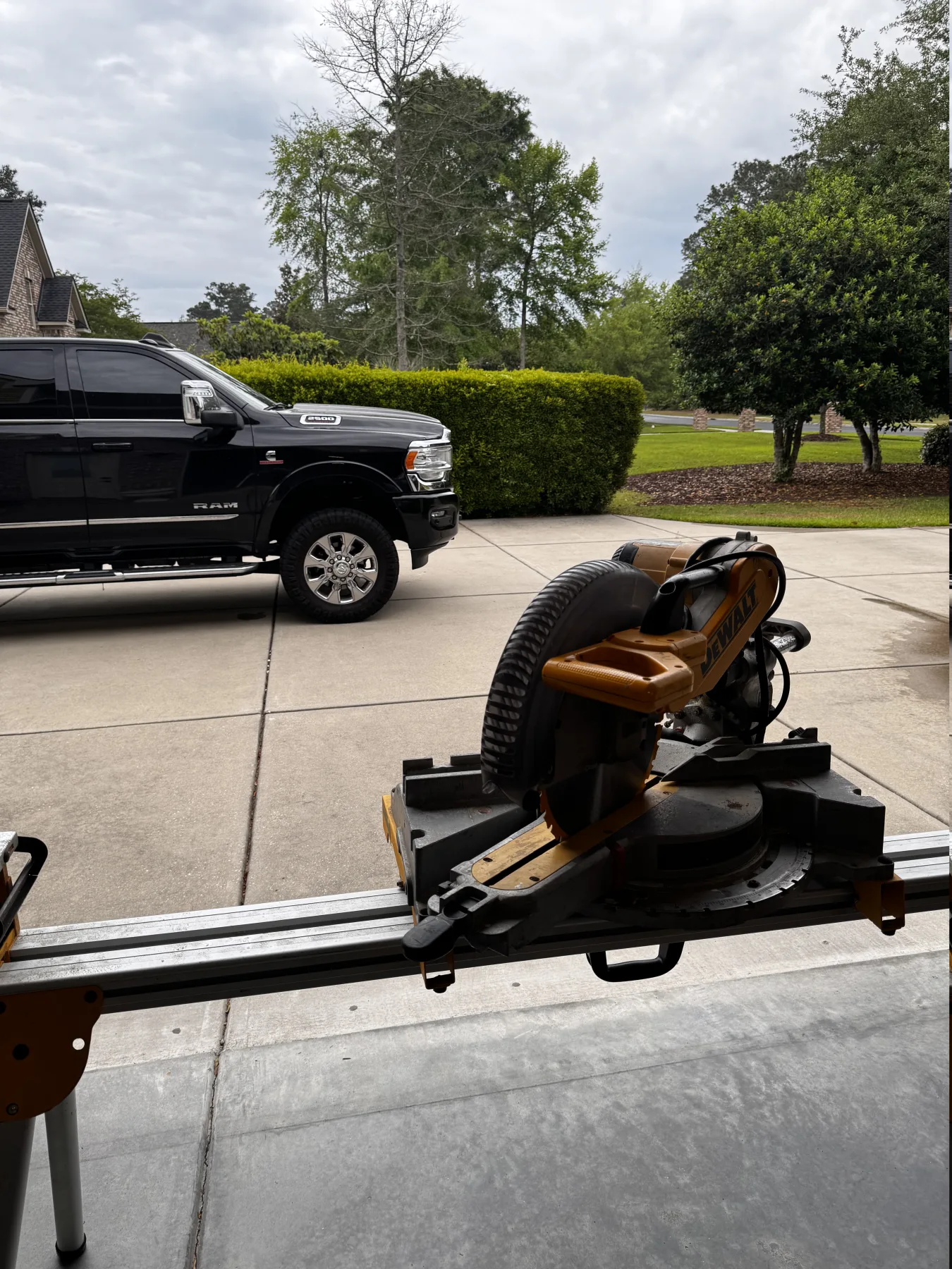 Mobile miter saw and trim setup outside a home