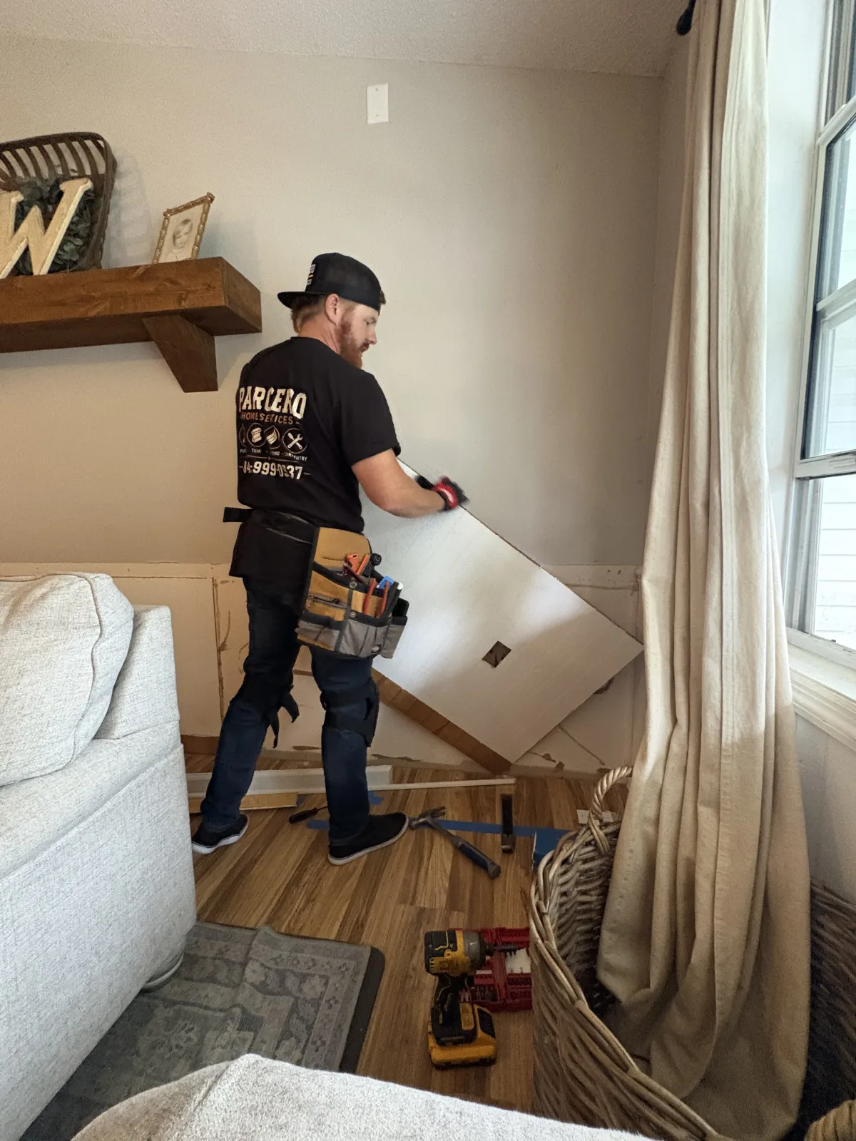Existing interior wall paneling being removed during demolition