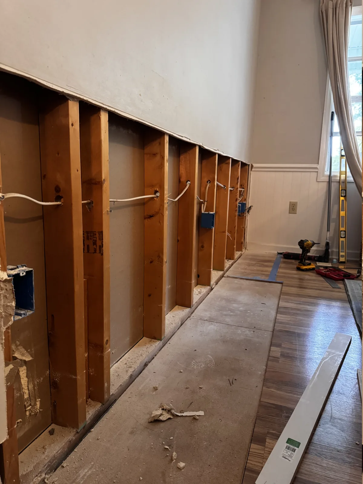 Lower interior wall opened to the studs during selective demolition